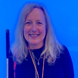 Sheri Albers Sheri Albers against a bright blue background