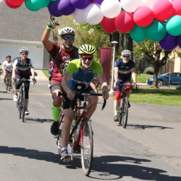 Tandem team David and Edwin ride their bike among four other bikers at Cycle for Sight in 2019