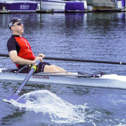 Chris Downey in a rowboat. Photo by Doug Olson, photographer