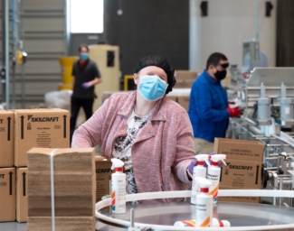Blind employees work on the assembly line at LightHouse Sirkin Center in Alameda
