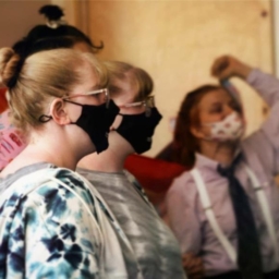 Teens wearing masks gather in the Kiva at EHC
