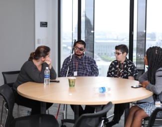 A group of LightHouse youth students sitting at a round table