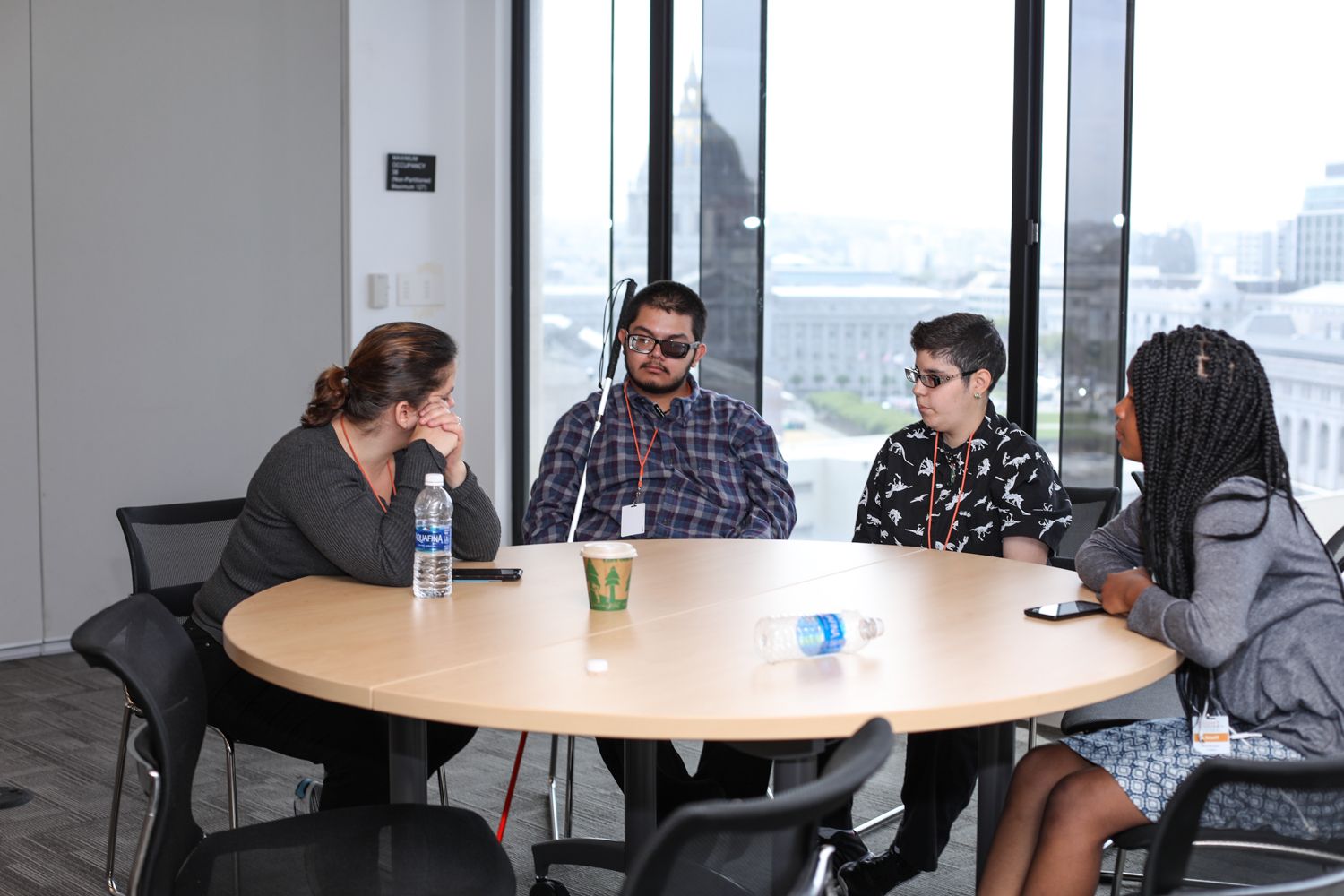 A group of LightHouse youth students sitting at a round table
