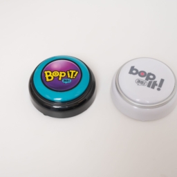 The Bop it button in color and black and white variations