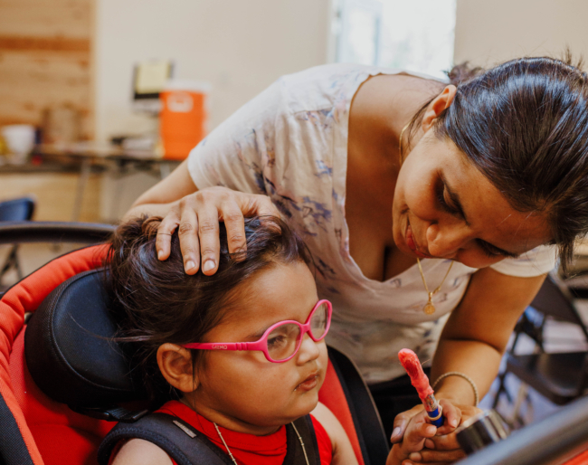 Shruti pats Little Learner on the head