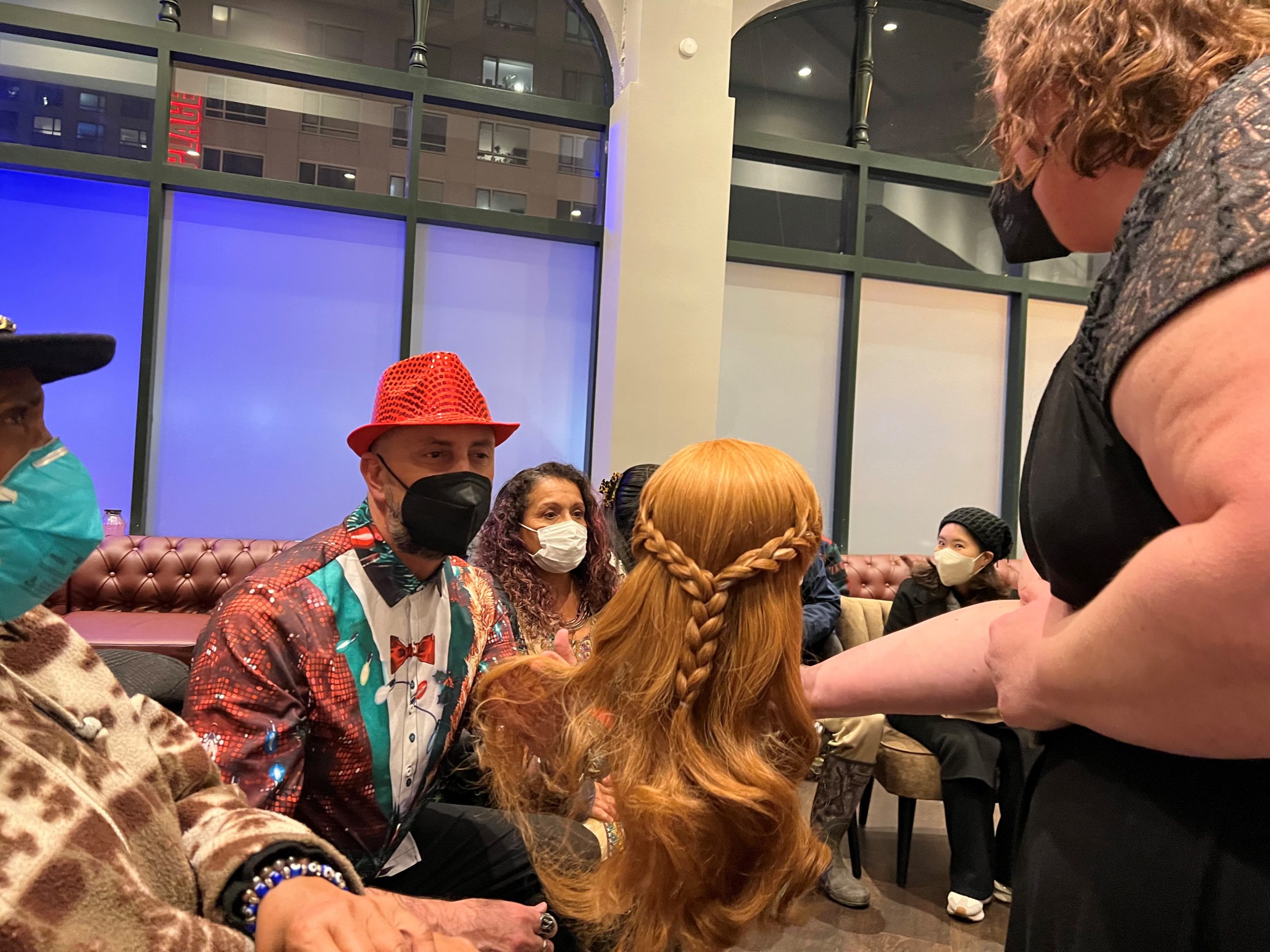 LightHouse student Carol touches a wig used in FROZEN the musical
