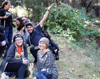 A group of teenage campers pose together on a hiking trail at Enchanted Hills Camp