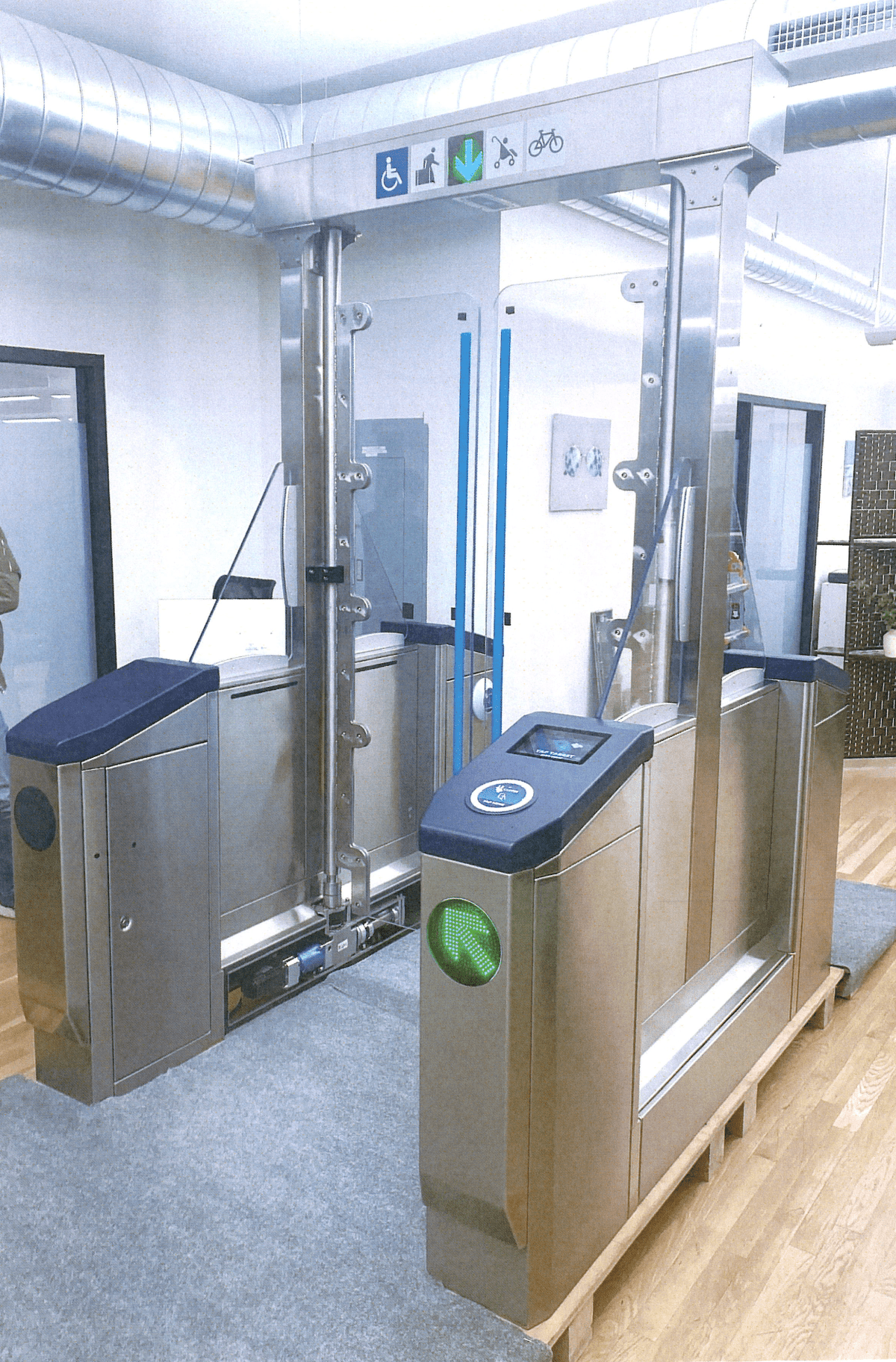 Rendering of the new accessible fare gate at a BART station with five foot high clear swing doors