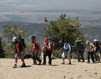 Group shot of the mountain guide, hikers and volunteersa